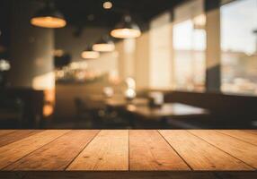 Empty wooden table in restaurant with light in background photo