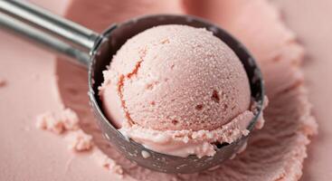 A scoop of ice cream with pink ice cream on top photo