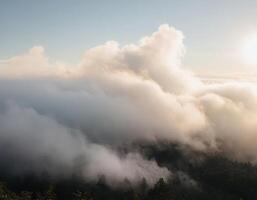 A view of the sun shining through the clouds photo
