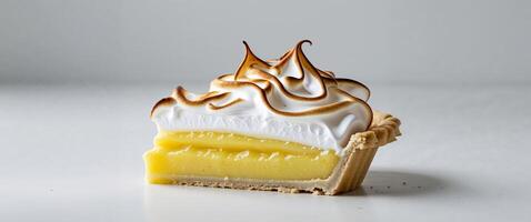 Lemon Meringue Pie Slice with Golden Meringue and Shortcrust Base. photo