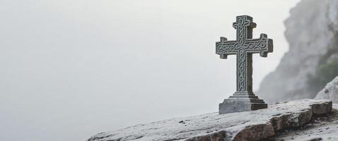 Celtic cross on the edge of a cliff photo