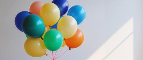 A bunch of balloons are sitting on a table photo