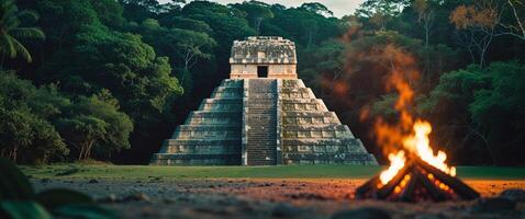 Maya pyramid surrounded by lush jungle and a glowing fire creating a captivating mystical atmosphere. photo