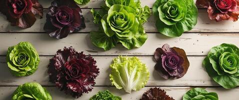 Fresh and Colorful Assortment of Organic Lettuce Varieties on Wooden Table Background for Healthy Eating. photo