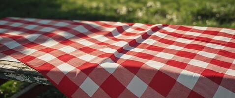 Bright red and white checkered tablecloth for outdoor picnics and gatherings photo