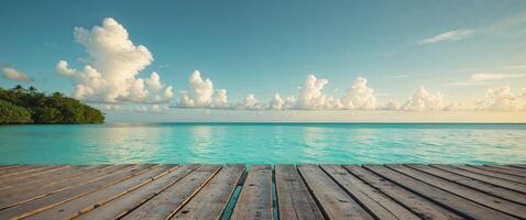 Tropical turquoise lagoon with a wooden deck extending over crystal clear waters. photo