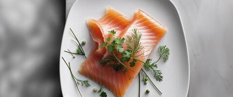 Closeup of a slice of smoked salmon garnished with herbs for culinary presentation photo