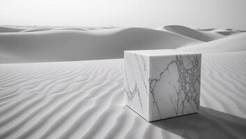 a lonely cube of marble on an endless sandy background. photo