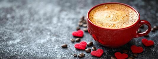 A red coffee cup with a heart on it sits on a table with coffee grounds and a heart-shaped cookie photo