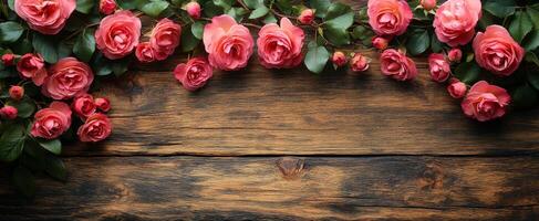 A wooden background with a bunch of red roses on it. The roses are arranged in a way that they are overlapping each other, creating a sense of depth and dimension. Scene is one of beauty and elegance photo