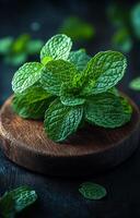 Mint leaves on wood display. Fresh mint leaves arranged beautifully on a dark wooden surface create a vibrant and fragrant composition. photo
