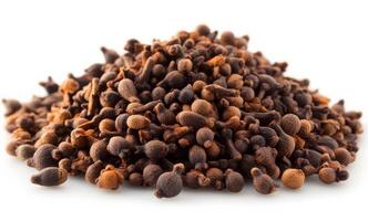 Mound of clove spices on white. A mound of whole cloves stands out against a white background, highlighting their dark color and unique shape. photo