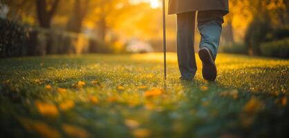 A person is walking in a field with a cane. Concept of independence and determination, as the person is navigating the grassy area on their own photo