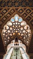 The inside of an ornate building with a pool photo