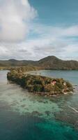 Aerial view of the island in the middle of the ocean photo