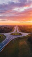 An aerial view of a highway at sunset photo