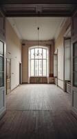 An empty room with a large window and wooden floors photo