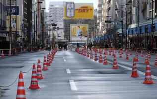 Tokyo, Japan - 3 January 2025 - A street is closed of in Asakusa, Tokyo, for Hakone Ekiden - the Tokyo-Hakone Round Trip College Ekiden Race - a university relay marathon between Tokyo and Hakone photo