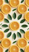 Creative layout orange slices with green leaves on white background flat lay with copy space photo