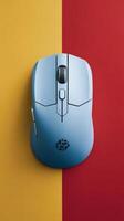Wireless computer mouse on a yellow and red background peripheral devices for computers photo
