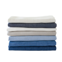 Neatly folded stack of blue and white fabric in various shades png