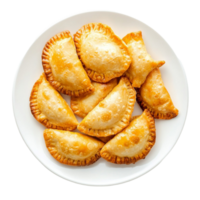 Plate of golden empanas with a flaky crust png