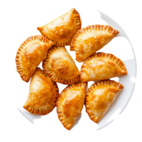 Golden empanas neatly arranged on white plate png