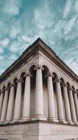 A building with columns and a sky background photo