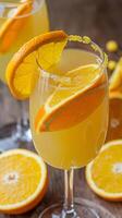 Two glasses of orange juice with slices of orange photo