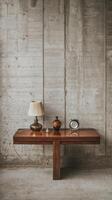 A wooden table with a lamp and vase on it photo