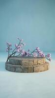 A stone platform with flowers on it photo