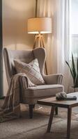 A chair and a lamp in a living room photo