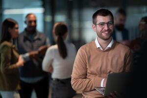 A successful business team working together in a modern startup office. Executives and employees collaborate, brainstorm, and showcase teamwork, leadership, and innovation in a confident, dynamic photo
