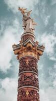 A statue of a man on top of a column photo