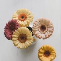 A vase of flowers on a table photo