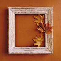 A white frame with a yellow maple leaf on it photo
