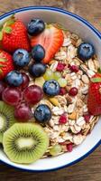 A bowl of cereal with fruit and nuts photo