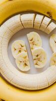 Bananas isolated on the white background peeled cut bananas banana slices fruit photo