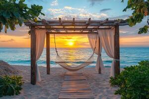 Hammock under a canopy overlooking tropical ocean during sunset photo