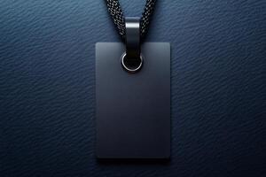 Empty black metallic label with string on textured leather, ideal for mockup photo