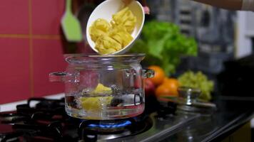 pasta nests Cooking process Step by step Water boils in a saucepan as nests of thin pasta are added to cook delicate spaghetti. Thin spaghetti noodles in the shape of a nest. instant noodles video