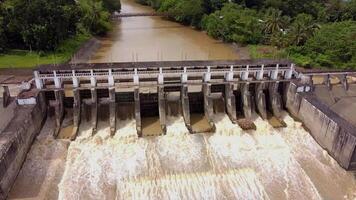 a large dam with water flowing over it video