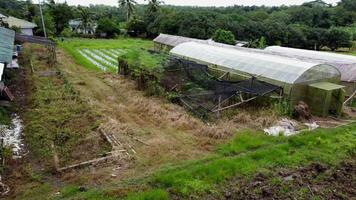 an aerial view of a farm with a greenhouse video