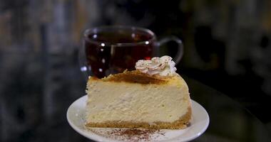 brew black tea Serving cheesecake slice on plate. Classical new york cheesecake video