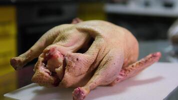 butcher a goose process of cutting up a goose Step by step getting the liver and navel out of the carcass of a tasty duck men's hands in gloves cutting up the catch cooking dinner recipe video