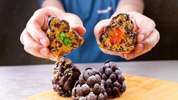 Chocolate pine cones made with chocolate cereal, focus on the pine cone in the center, close up view. Christmas delicious dessert photo