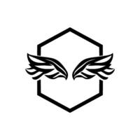 Black and white illustration of stylized angel wings inside a geometric hexagon frame, symbol of freedom. vector