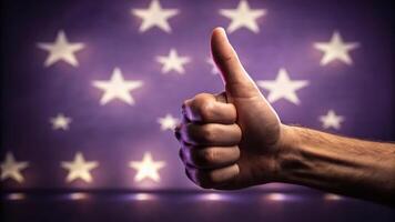A hand giving the thumbs up with stars in the background photo