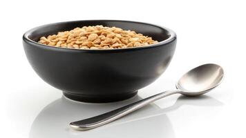 Bowl of cereal with spoon on white background photo