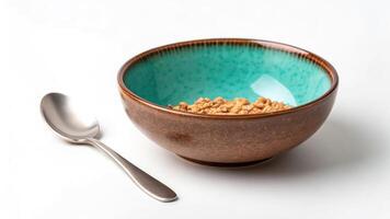 Bowl of cereal with spoon on white background photo